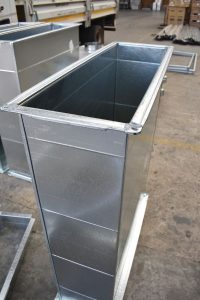 A rectangular duct section on the manufacturing line