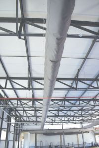 A fabric/textile installation in a large indoor sports facility.