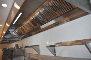 A stainless steel; extract hood in a speciality kitchen.