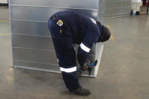 A Ductshop quality inspector carefully examines finished products as they leave the manufacturing division. Each part is scrutinised to maintain the highest quality standards before being staged for dispatch.
