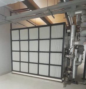 Chilled and hot water air handling unit. Primary fresh air filtersand behind them are the secondary filters for the fresh air supply, which is one of two fresh air supply systems