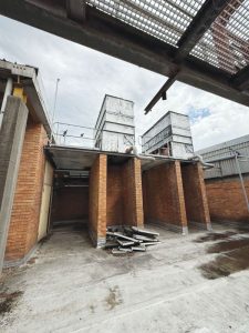 The cooling towers of the original chilled water system were badly corroded and removed for safety reasons.