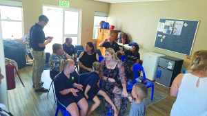 SAIRAC Cape Town Centre representatives hand over donated classroom equipment and financial support to Club21 Bellville in support of children with Down syndrome. <credit> SAIRAC Cape Town Centre